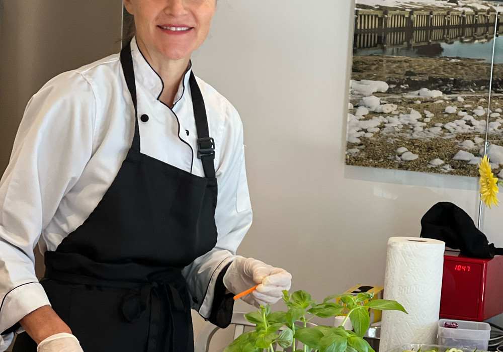 Carol preparing fresh herbs